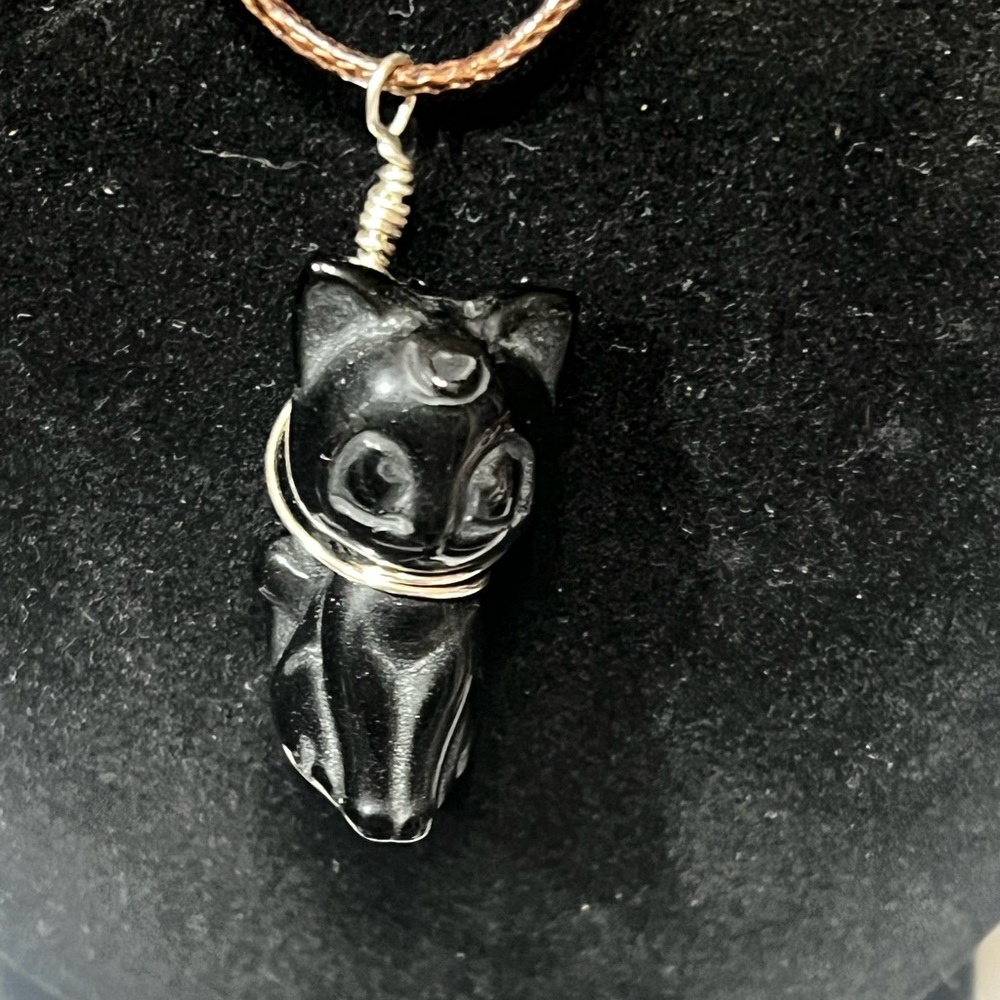 Black stone carved Kitty with hand made harness.